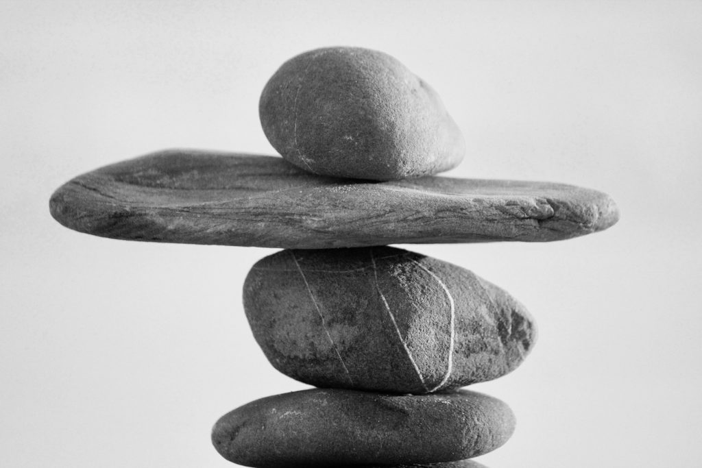 perfectly balanced rocks to reference the balance an moa strikes between legal enforceability and level of detail