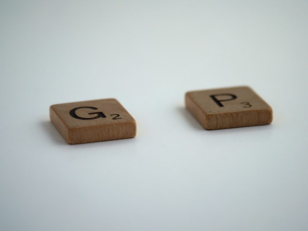 scrabble tiles spelling the word gap but hte a in the middle is missing to symbolise how edwin lee and partners can identify gaps in partnership agreements